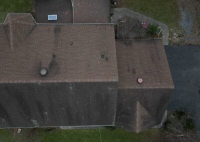 Before look of roof with signs of shingle damage
