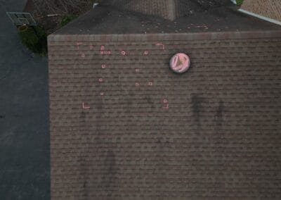 Before look of roof with signs of shingle damage