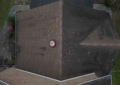 Before look of roof with signs of shingle damage