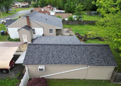 After look of roof replacement project with Owens Corning Duration shingles in Midnight Plum