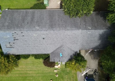 Before look of project with signs of shingle damage