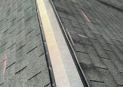 Before look of roof with signs of shingle damage