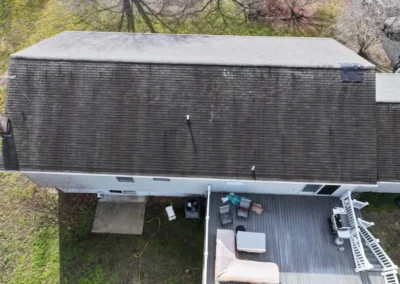 Before look of project with signs of shingle damage