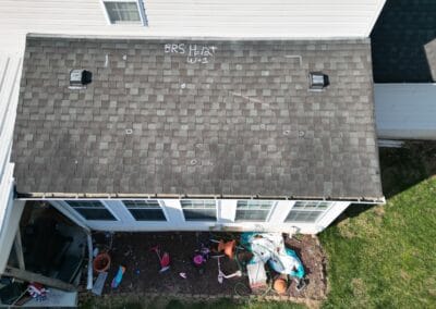 Before look of roof with signs of shingle damage