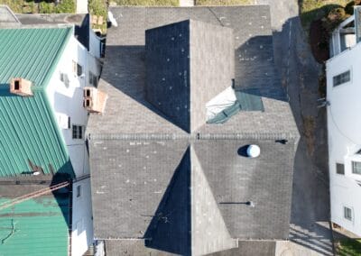 Before look of roof with signs of shingle wear