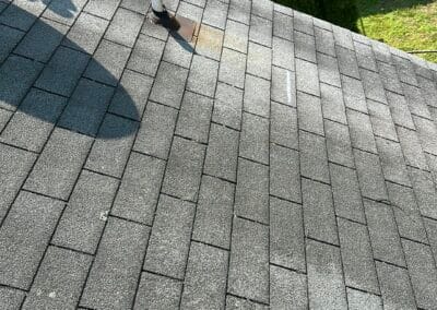 Before look of roof project with signs of shingle damage