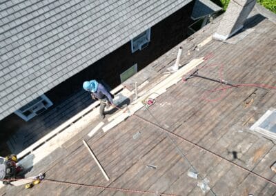 Before look of roof with signs of roofing system damage