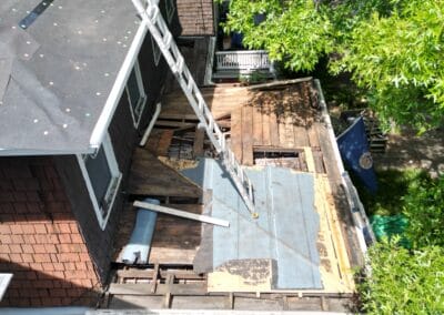 Before look of roof with signs of roofing system damage