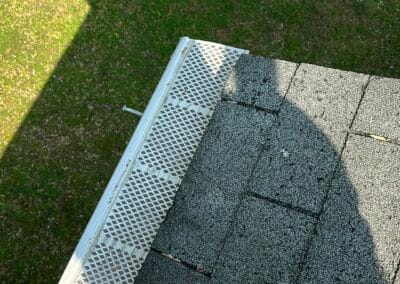 Before look of roof project with signs of shingle damage