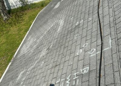 Before look of roof project with signs of shingle damage