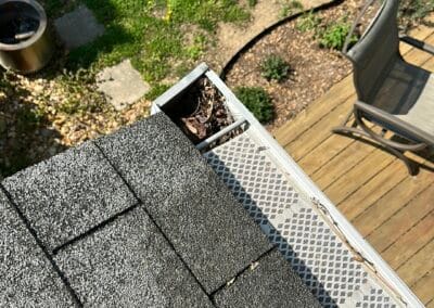 Before look of roof project with signs of shingle damage