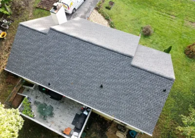 After look of project with GAF Timberline HDZ roofing system in Pewter Gray, along with new 5" white gutters