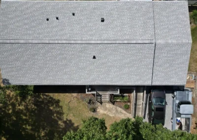 Brand new look of roof with GAF Timberline HDZ architectural shingles in Fox Hollow Grey