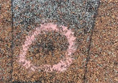 Before look of roof with signs of shingle damage