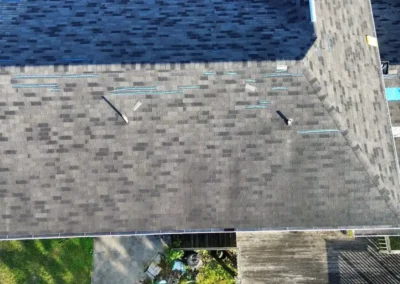 Before look of roof with aging and gutter system