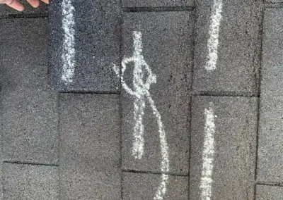 Before look of roof with signs of shingle damage