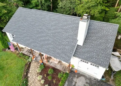 After look of project with GAF Timberline HDZ roofing system in Pewter Gray, along with new 5" white gutters