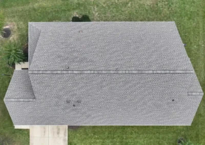 After look of the roof with GAF Timberline HDZ roofing system in Weathered Wood paired with a white aluminum drip edge and upgraded Snow Country ridge vents.