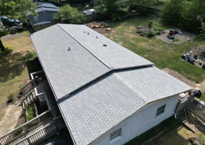 Brand new look of roof with GAF Timberline HDZ architectural shingles in Fox Hollow Grey