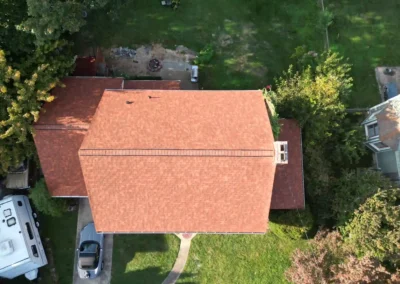 After look of roof replacement with Terra Cotta shingles by Owens Corning