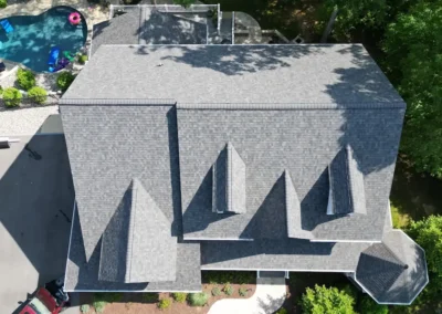 After look of project with the roof having Owens Corning Duration shingles in Williamsburg Grey