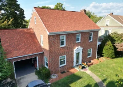After look of roof replacement with Terra Cotta shingles by Owens Corning