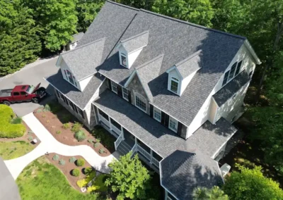 After look of project with the roof having Owens Corning Duration shingles in Williamsburg Grey