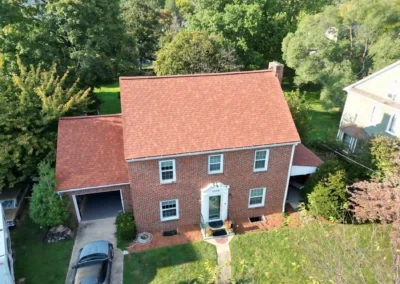 After look of roof replacement with Terra Cotta shingles by Owens Corning