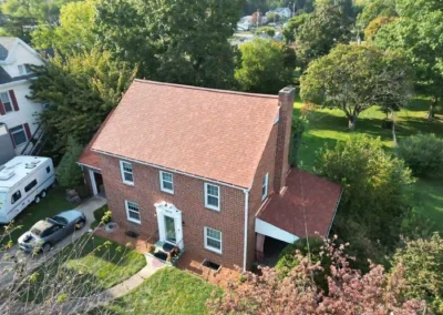 After look of roof replacement with Terra Cotta shingles by Owens Corning
