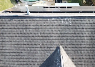 Before look of roof with signs of shingle damage