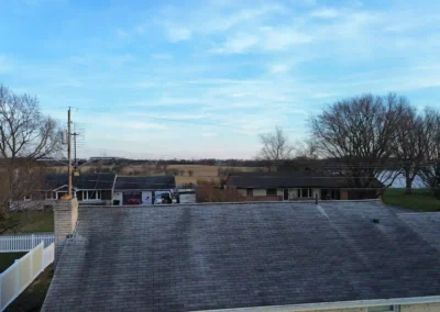 Before look of roof with signs of shingle wear