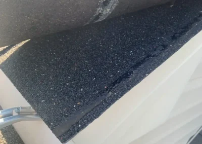 Before look of roof with signs of shingle degradation