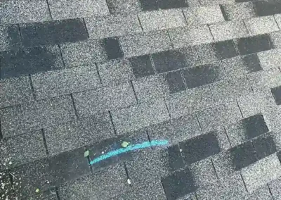 Before look of roof with aging and gutter system