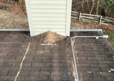 Before look of roof with signs of shingle damage